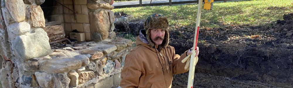 Tim preparing the foundation restore for the Pryce cabin.