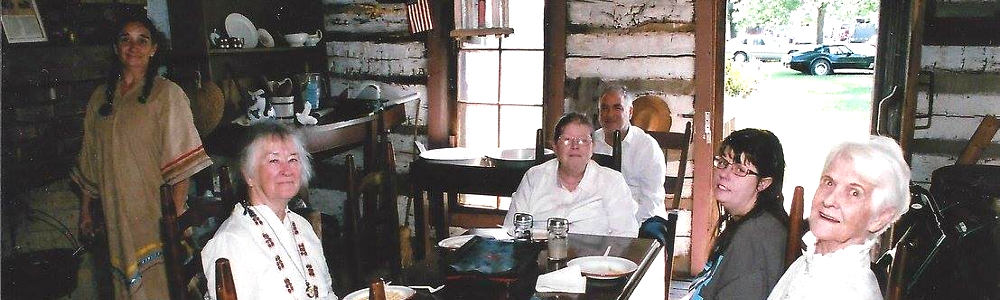 Enjoying a rest after a sumptuous chicken and noodles dinner cooked at fireplace (hearth cooking).